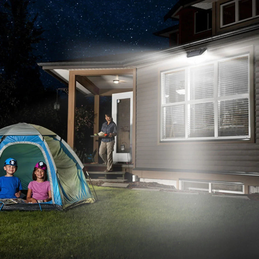 Solar-Powered Outdoor Spotlight with Motion Sensor shown in use