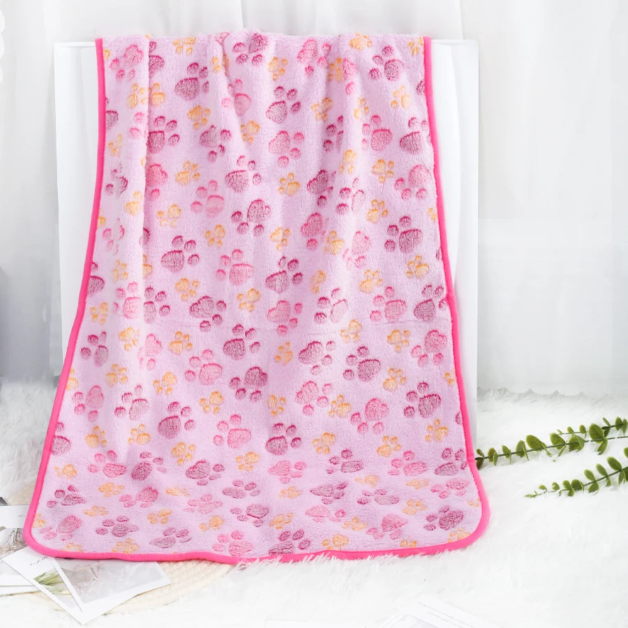 Soft Fleece Pet Blanket — Warm Paw Print Blanket for Dogs & Cats shown in use