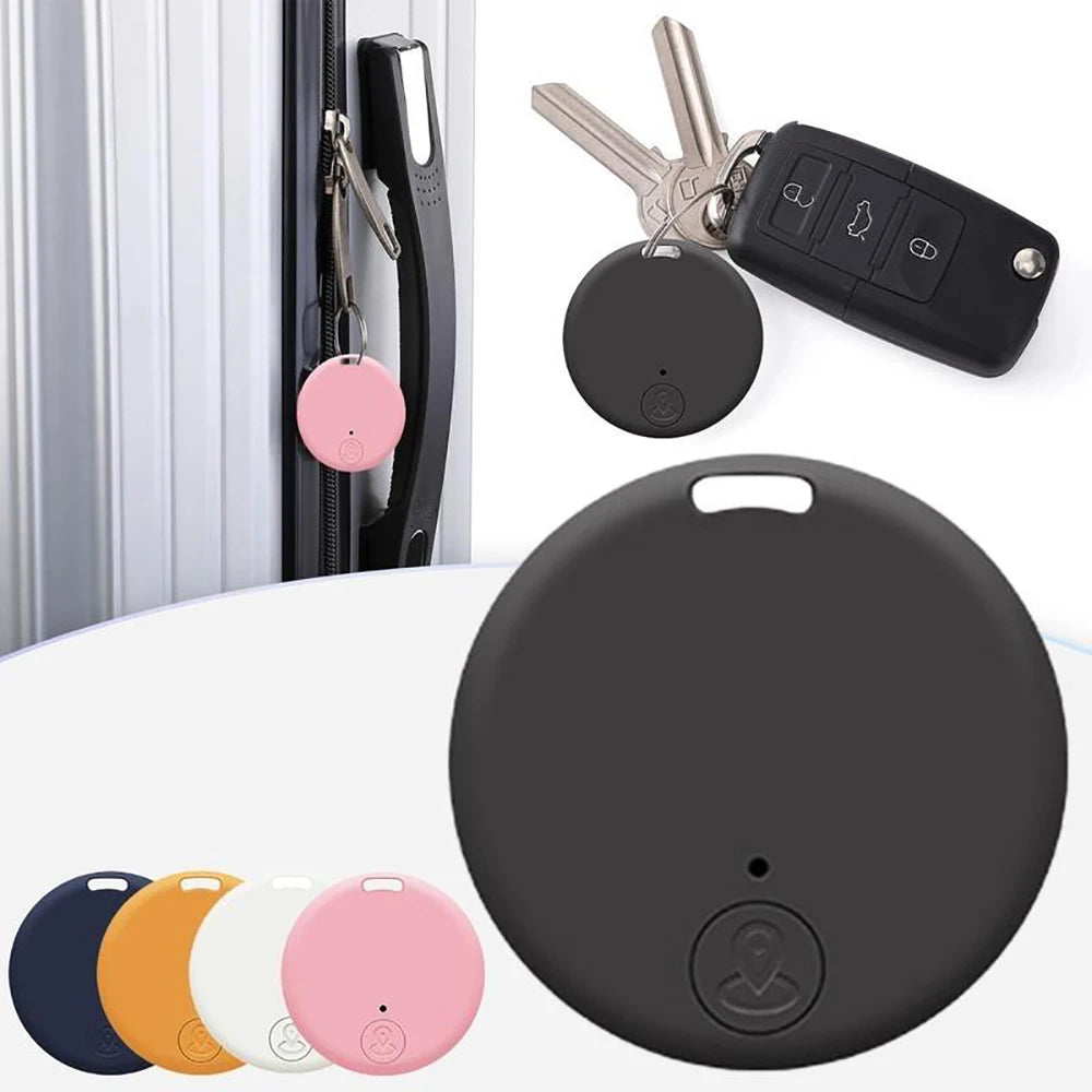 Mini Bluetooth smart tracker in orange, held in hand to show compact size